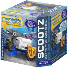 Load image into Gallery viewer, This image shows a cubic product box for a motorized building toy called "ReBotz: Scootz, The Cranky Crawling Robot," designed for ages 6 and up by Thames &amp; Kosmos. The packaging features a gritty, graffiti-style concrete backdrop showcasing a quirky robot made from mismatched parts, including a white battery-pack body, two large cartoonish googly eyes on top, and spoked yellow pirate wheels that pull it across the floor.
