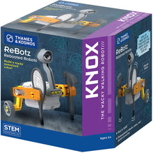 Load image into Gallery viewer, This image shows a cubic product box for a motorized building toy called "ReBotz: Knox, The Wacky Walking Robot," designed for ages 6 and up by Thames &amp; Kosmos. Set against a gritty, textured grey backdrop with purple accent panels, the featured robot stands on a pair of yellow legs with small grey wheels and uses a miniature tennis racket and a grey hammer as its arms to amble forward.

