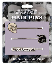 Load image into Gallery viewer, Set of three Edgar Allan Poe-themed bobby pins featuring a skull, a raven, and the word "nevermore".
