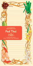 Load image into Gallery viewer, A lined notepad page is framed by an illustration of Pad Thai ingredients—including noodles, shrimp, bean sprouts, lime, and crushed peanuts—under a red branded cover band labeled "Pad Thai."
