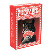 Load image into Gallery viewer, A red tuck box titled "MONSTERS OF FOLKLORE PLAYING CARDS" shows a dark werewolf holding a hand of red playing cards in front of its face.
