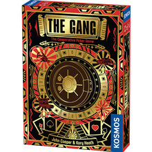 Load image into Gallery viewer, This image shows the front of a rectangular product box for a cooperative poker game called "The Gang," designed by John Cooper and Kory Heath. The striking box art features a bold, art-deco inspired theme in gold, red, and black, centered around a large illustration of a round bank vault door surrounded by tiny icons of a sports car, a camera, a laptop, and playing card suits.
