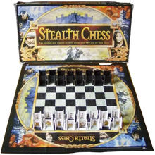 Load image into Gallery viewer, An open "Stealth Chess" game box showing a black and white checkered board set up with black castle-shaped pieces on one side and white castle-shaped pieces on the other.
