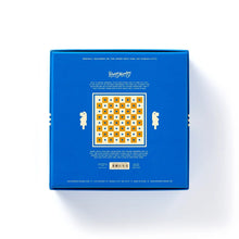 Load image into Gallery viewer, The back cover of a bright blue Brass Monkey chess set box displaying product details and a central diagram of the peg board.
