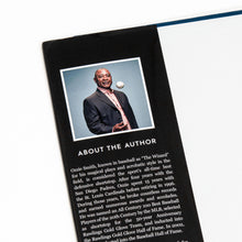 Load image into Gallery viewer, The author photo features baseball legend Ozzie Smith on the book flap, he is captured mid-action tossing a baseball into the air beside his head.
