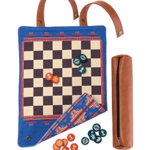 Load image into Gallery viewer, A southwestern-patterned blue canvas game board shown unrolled with red and teal wooden playing discs next to its brown leather zipper pouch and snap closure straps.
