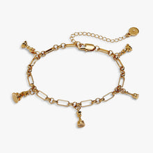 Load image into Gallery viewer, A gold paperclip-link chain bracelet featuring miniature chess piece charms, including a king, queen, rook, knight, and pawn, with an extender chain and lobster clasp.
