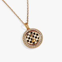 Load image into Gallery viewer, Gold chain necklace featuring a circular pendant with a crystal-encrusted outer frame surrounding a spinning checkered center with a gold king chess piece.
