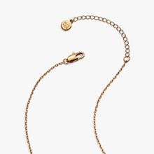Load image into Gallery viewer, Close-up of the fine gold link chain necklace showing its lobster claw clasp, extender chain, and circular Alex and Ani brand tag.
