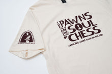 Load image into Gallery viewer, Displaying the front of the t-shirt with the quote "The Pawns are the soul of chess" along with the World Chess Hall of Fame and Galleries logo on the sleeve.
