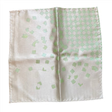 Load image into Gallery viewer, This is a light beige pocket square decorated with a pale mint-green checkered pattern in the upper-right corner that scatters out into small square shapes.
