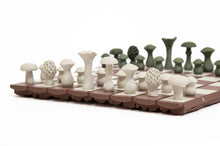 Load image into Gallery viewer, A close-up side view highlights the intricate 3D-printed textures of the off-white mushroom chess pieces standing on the segmented board.
