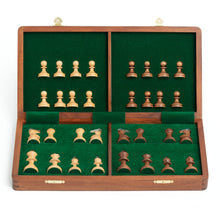Load image into Gallery viewer, An open wooden chess box reveals neatly organized light and dark wooden pieces stored in four green felt-lined compartments.
