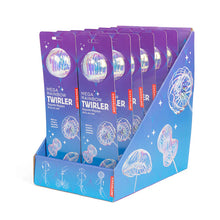 Load image into Gallery viewer, Kikkerland "Mega Rainbow Twirler". The packaging features a vibrant blue and purple galaxy-like theme with white stars, showcasing an iridescent, clear spherical top and illustrative graphics demonstrating how the toy spins to create dazzling, fluid rainbow shapes.

