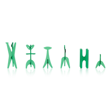 Load image into Gallery viewer, A row of six translucent green abstract acrylic chess pieces standing against a plain white background.
