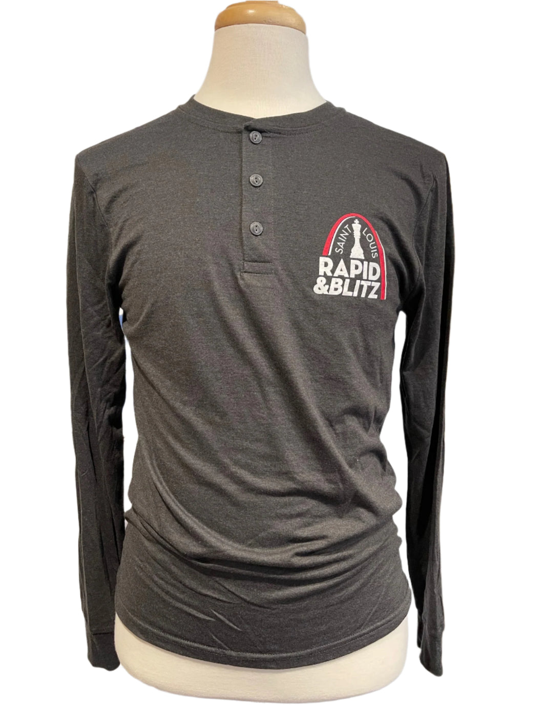 Image of charcoal long sleeve mens henley pullover with Saint Louis Rapid and Blitz logo over the left breast. 