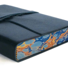 Load image into Gallery viewer, Midnight Blue high-grade leather features a rustic wrap-around tie closure and a soft suede interior with color-coordinated marbled paper detailing along the inner edges
