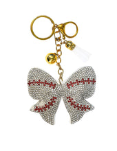 Load image into Gallery viewer, playful crystal bow detailed with red baseball-style stitching
