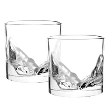 Load image into Gallery viewer, A set of two clear whiskey glasses, each featuring a raised 3D glass mold of canyon rock formations sculpted into the base.
