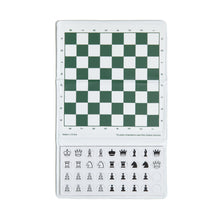 Load image into Gallery viewer, A top-down view of an open magnetic travel chess set featuring a green and white algebraic chessboard at the top and round black-and-white chess piece tokens stored in a designated panel below.   
