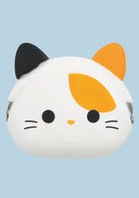 Load image into Gallery viewer, This is a small, round silicone coin purse shaped like a cute calico cat's head against a light blue background.
The pouch features a smooth white face with simple black dot eyes, thin whiskers, a tiny yellow nose, and a large orange patch over one eye. Two pointed ears extend from the top—one solid black and one solid orange. It uses a metal kiss-lock clasp hidden within the silicone frame, with only the silver hinges visible on the sides.

