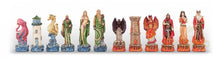 Load image into Gallery viewer, A line of intricately detailed chess pieces featuring mythological sea creatures in blue-and-green tones on the left and fiery, dark fantasy figures in red-and-gold tones on the right.
