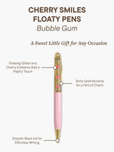 Load image into Gallery viewer, Set against a plain white background, features a diagram of the pink-barreled "Cherry Smiles Floaty Pen" surrounded by descriptive text callouts. Three thin lines point directly to key product features, highlighting the floating cherry emblems in the gold glitter, the shiny gold accents, and the smooth black ink tip at the bottom.
