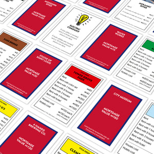 Close-up of property cards from the St. Louis edition MONOPOLY game, featuring 'Tower Grove Park' as the focal point.