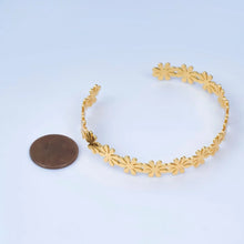 Load image into Gallery viewer, 24K Gold-Filled Floral Bangle blends delicate botanical artistry with a rich, radiant golden finish
