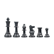 Load image into Gallery viewer, A line of solid black plastic chess pieces arranged in descending order of height from king to pawn against a white background.
