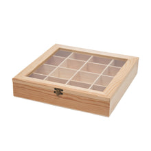Load image into Gallery viewer, A closed rectangular light pine display box with a clear glass lid revealing sixteen small compartments inside and a bronze latch on the front.
