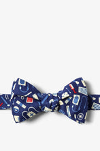Load image into Gallery viewer, Blue bow tie with a colorful pattern of medical tools and supplies.
