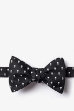 Load image into Gallery viewer, Black bow tie with a subtle repeating white skull pattern.
