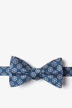 Load image into Gallery viewer, Blue bow tie with a white repeating snowflake pattern.

