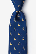 Load image into Gallery viewer, Navy blue necktie featuring a repeating pattern of tiny gold leaping stags.
