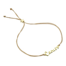 Load image into Gallery viewer, This image shows the unboxed "Cancer" bracelet arranged in a loose loop against a plain white background. The delicate cursive gold nameplate rests at the bottom, while the double-strand tan cord threads through a tiny, metallic gold star-shaped slider at the top to adjust the fit.
