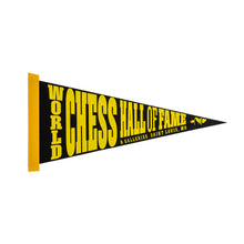 Load image into Gallery viewer, Triangular black felt pennant bordered by a stitched yellow strip along the wide left edge. Bold yellow typography spells out "WORLD CHESS HALL OF FAME" across the body, accompanied by smaller text reading "&amp; GALLERIES SAINT LOUIS, MO" along the bottom edge.
