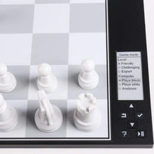 Load image into Gallery viewer, A detailed close-up of white chess pieces on the electronic board showing the e-paper menu screen with game mode and difficulty settings.
