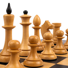 Load image into Gallery viewer, A low-angle close-up of light-colored, smoothly carved wooden chess pieces set up in starting formation on a board.
