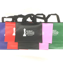 Load image into Gallery viewer, A line of five zippered chess piece bags with black carrying handles, displayed in purple, red, black, pink, and green, each printed with the white "World Chess Hall of Fame, Saint Louis, MO" logo on the front.
