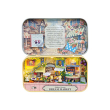 Load image into Gallery viewer, A hidden dream market inside a flat tin container. 
