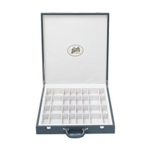 Load image into Gallery viewer, An open, dark slate gray leatherette chess storage briefcase with a white felt interior featuring individual grid compartments for pieces.
