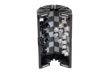 Load image into Gallery viewer, A partially closed VentureBoard mini travel chess set shown standing upright, illustrating how the chess pieces stay securely attached to the interior grid as the sides fold inward.
