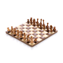Load image into Gallery viewer, &quot;Modern walnut and maple chess set, wobbling pieces, with chrome accents, 16-inch board, 1.75-inch squares, and 3.5-inch king. Concave design stabilizes pieces for a unique display.&quot;
