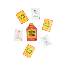Load image into Gallery viewer, Top view of the Ring of Fire drinking card game with cards spread around the bottle-shaped tin, showcasing rules and designs for party fun.
