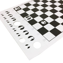 Load image into Gallery viewer, A close-up view of a printed paper chess set showing punch-out circular piece tokens along the side of a black-and-white grid board.
