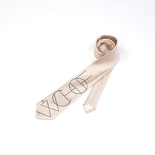 Load image into Gallery viewer, A light champagne/beige tie printed with black graphic linework.

