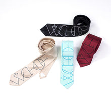 Load image into Gallery viewer, Shows all four ties loosely rolled and layered together against a seamless white studio background.

